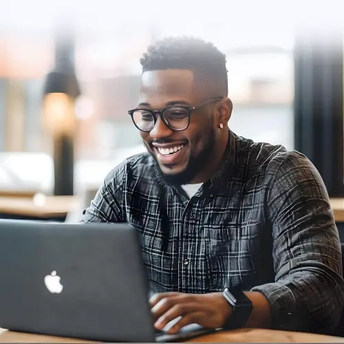 man-using-telehealth-laptop